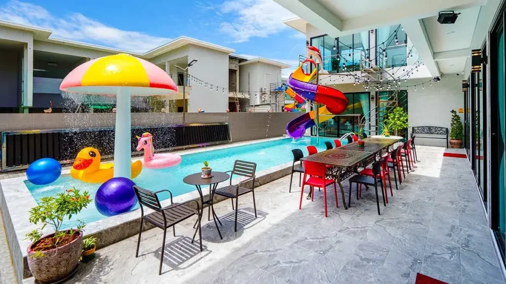 mushroom fountain and long outdoor dining table beside private pool hua hin villa